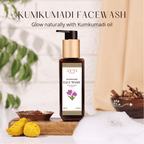 Ayni Kumkumadi Face Wash bottle with natural elements on a blurred background