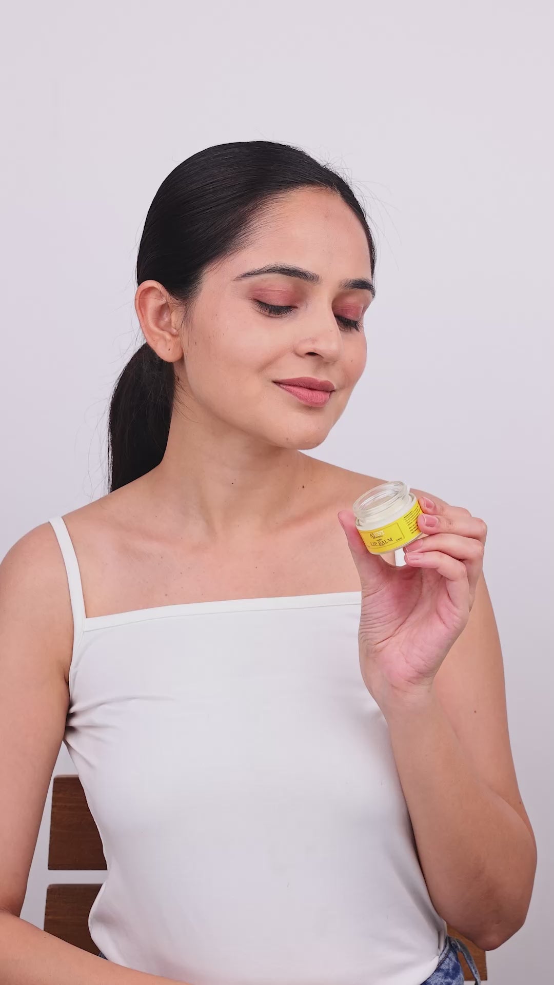 A video featuring how to apply ghee lip balm