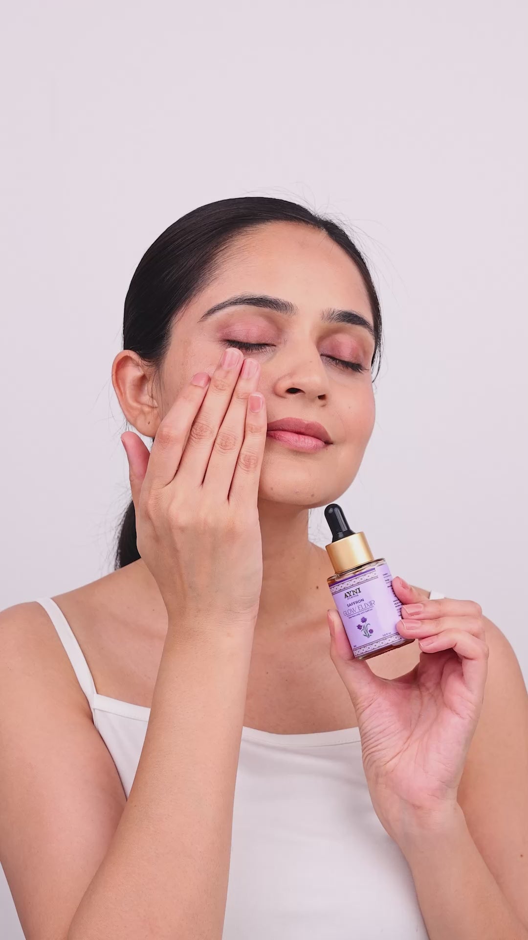 A Lady representing how to apply saffron grow elixir